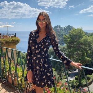 Realisation Par black and white star silk mini wrap dress